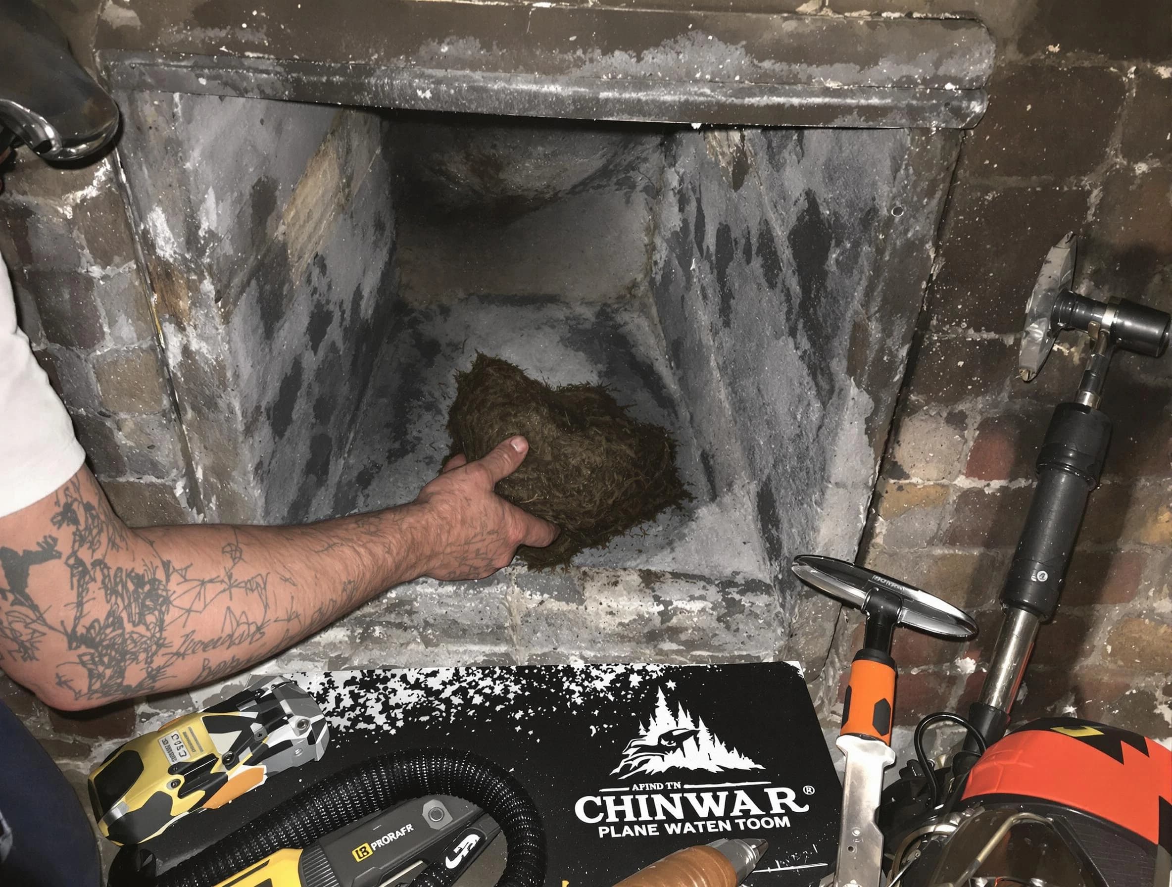 Acworth Chimney Sweep safely removing debris and screening chimney in Acworth, GA
